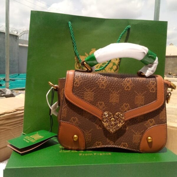 Luxury Monogram Top-Handle Satchel with Ornate Heart Clasp